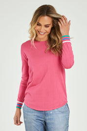 Model Alice wearing the Sophie Knit Jumper in colour Rosa (Pink), from the front, cropped image