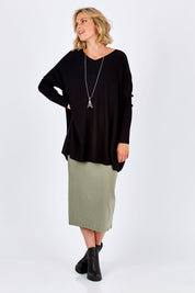 Model Chelsea wearing size 10 of the Ella Knit Tunic in colour Black (Black), from the front, showing the whole outfit