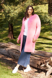 A model wearing the Mia Cardigan in colour Floss (Pink), from the front, showing the whole outfit