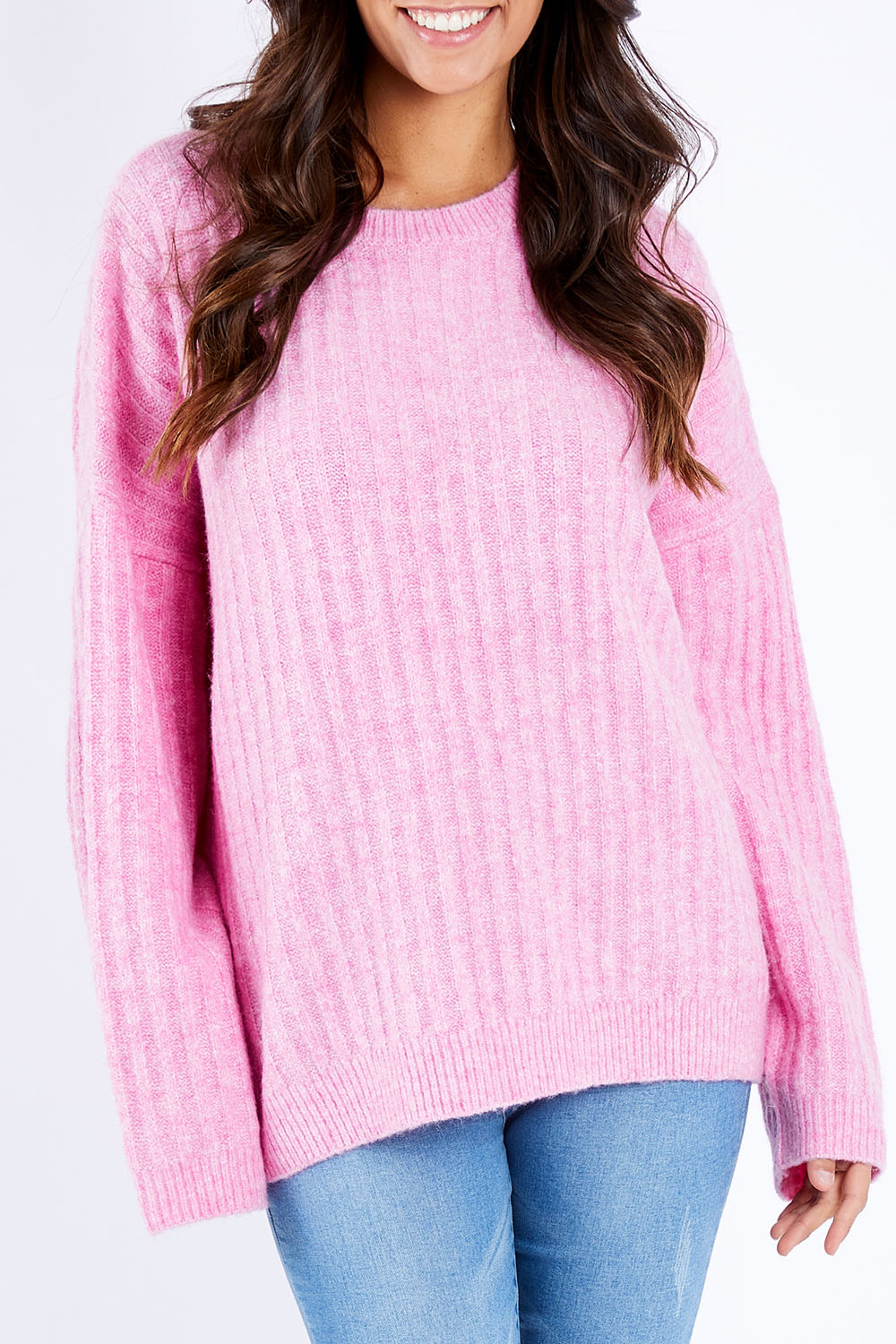 Model Vitoria wearing size S of the Kayla Knit Jumper in colour Floss (Pink), from the front, cropped image