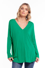 A model wearing the Oslo Top in colour Lime (Green), from the front, cropped image
