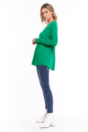 A model wearing the Oslo Top in colour Lime (Green), from the front, showing the whole outfit