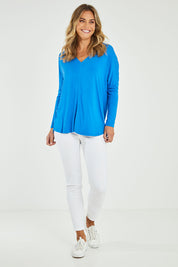 Model Alice wearing size 10 of the Oslo Top in colour Ultramarin (Blue), from the front, showing the whole outfit