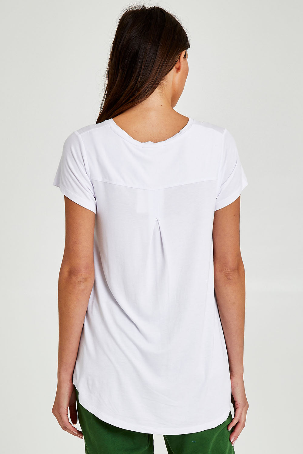 Model Madeline wearing size 10 of the Matilda Tee in colour White (White), from the back