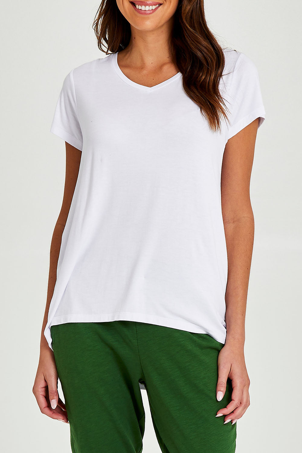 Model Madeline wearing size 10 of the Matilda Tee in colour White (White), from the front, cropped image