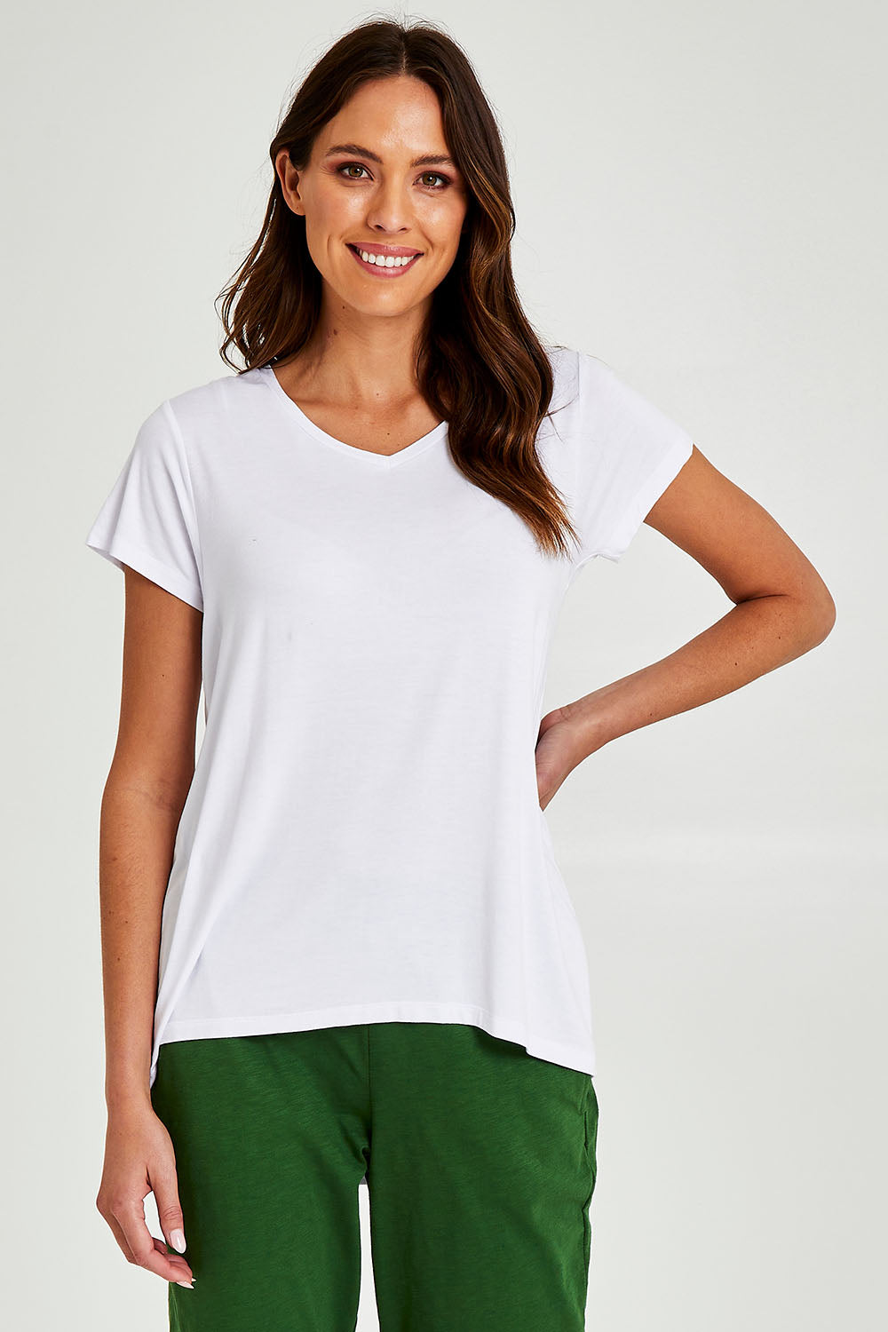 Model Madeline wearing size 10 of the Matilda Tee in colour White (White), from the front, cropped image