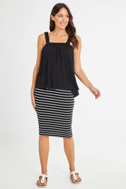 Model Madeline wearing size 10 of the Susie Tank in colour Black (Black), from the front, showing the whole outfit