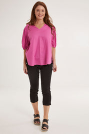 Model Sally wearing size 10 of the Crop Bengaline Pant in colour Black (Black), from the front, showing the whole outfit