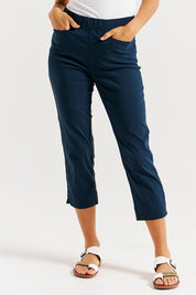 A model wearing the Crop Bengaline Pant in colour Navy (Blue), from the front, cropped image