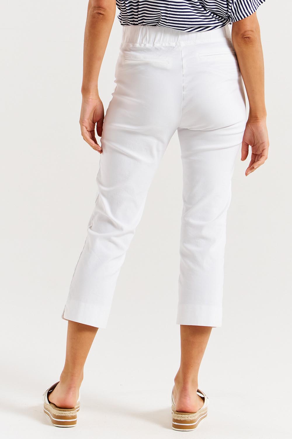 A model wearing the Crop Bengaline Pant in colour White (White), from the back
