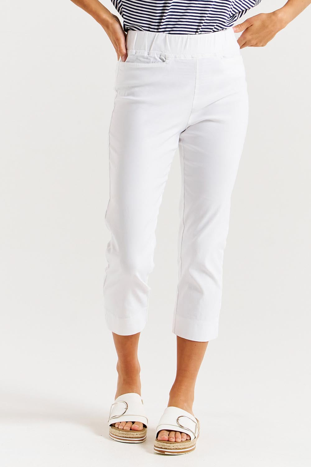 A model wearing the Crop Bengaline Pant in colour White (White), from the front, cropped image