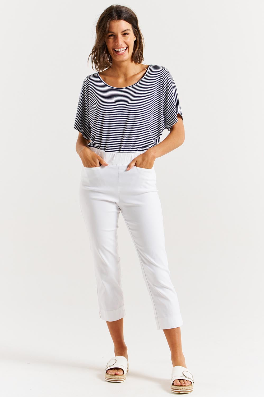 A model wearing the Crop Bengaline Pant in colour White (White), from the front, showing the whole outfit