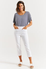 A model wearing the Crop Bengaline Pant in colour White (White), from the front, showing the whole outfit