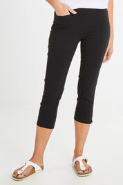 Model Madeline wearing size 10 of the Crop Bengaline Pant in colour Black (Black), from the front, cropped image