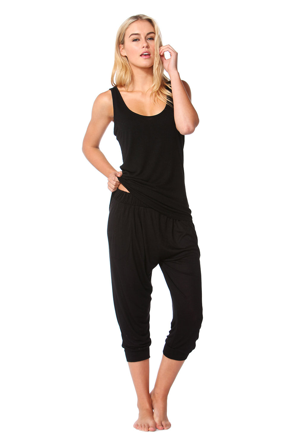 A model wearing the Miami Stretch Singlet in colour Black (Black), from the front, showing the whole outfit