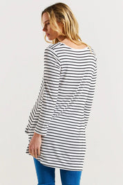 A model wearing the Cairo Tunic Bamboo Top in colour Monostripe (White), from the back