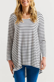 A model wearing the Cairo Tunic Bamboo Top in colour Monostripe (White), from the front, cropped image
