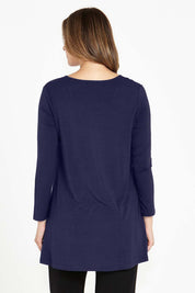 A model wearing the Cairo Tunic Bamboo Top in colour Navy (Blue), from the back