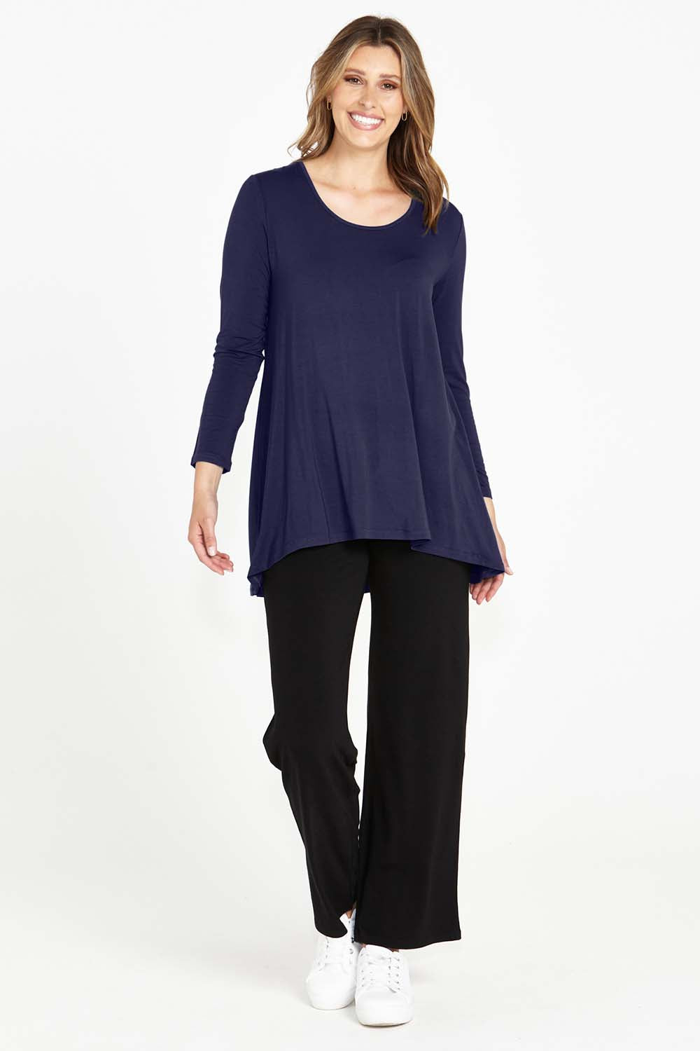 A model wearing the Cairo Tunic Bamboo Top in colour Navy (Blue), from the front, showing the whole outfit