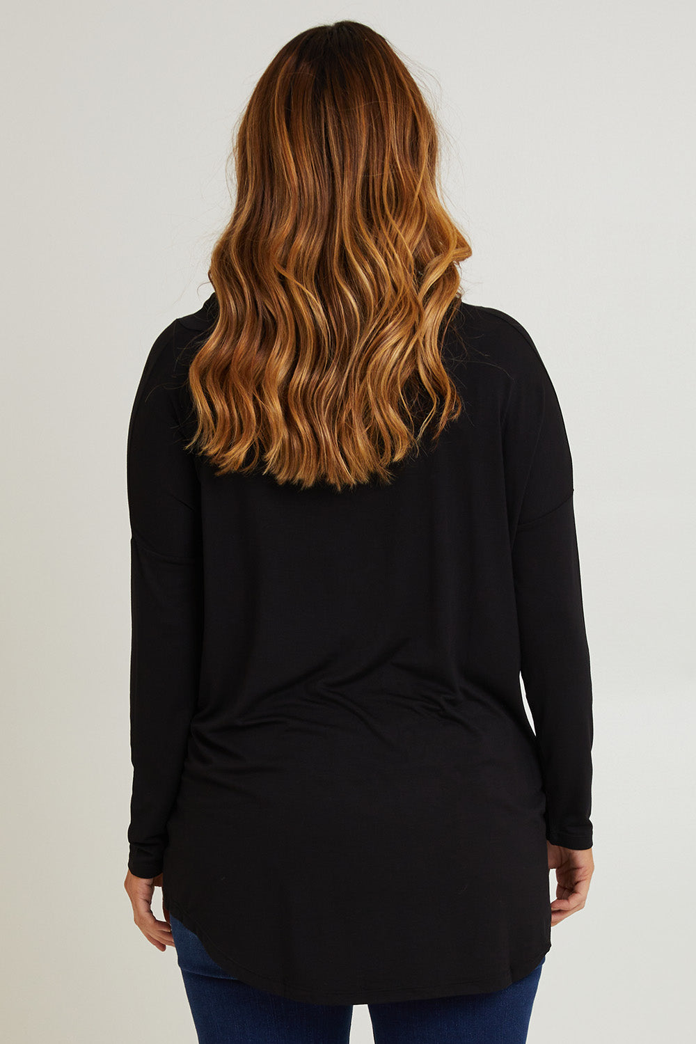 Model Laura wearing size 14 of the Cowl Bamboo Top in colour Black (Black), from the back