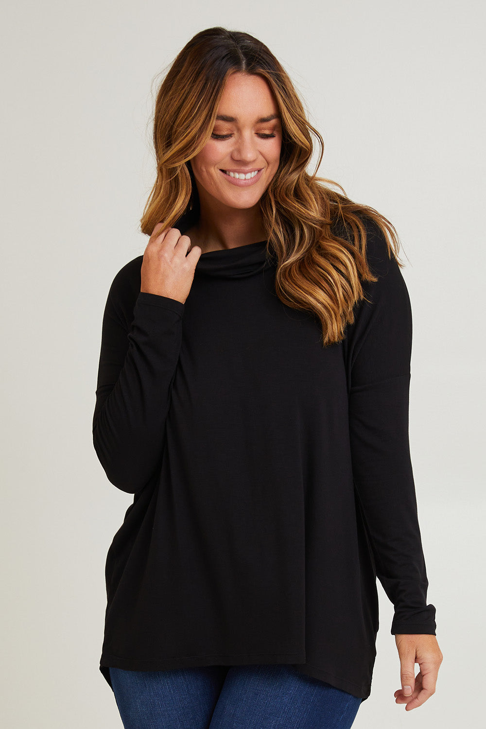 Model Laura wearing size 14 of the Cowl Bamboo Top in colour Black (Black), from the front, cropped image