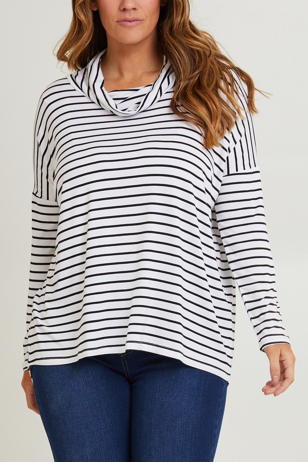 Model Laura wearing size 14 of the Cowl Bamboo Top in colour Monostripe (White), from the front, cropped image