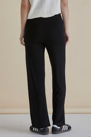 A model wearing the Houston Relaxed Pant in colour Black (Black), from the back