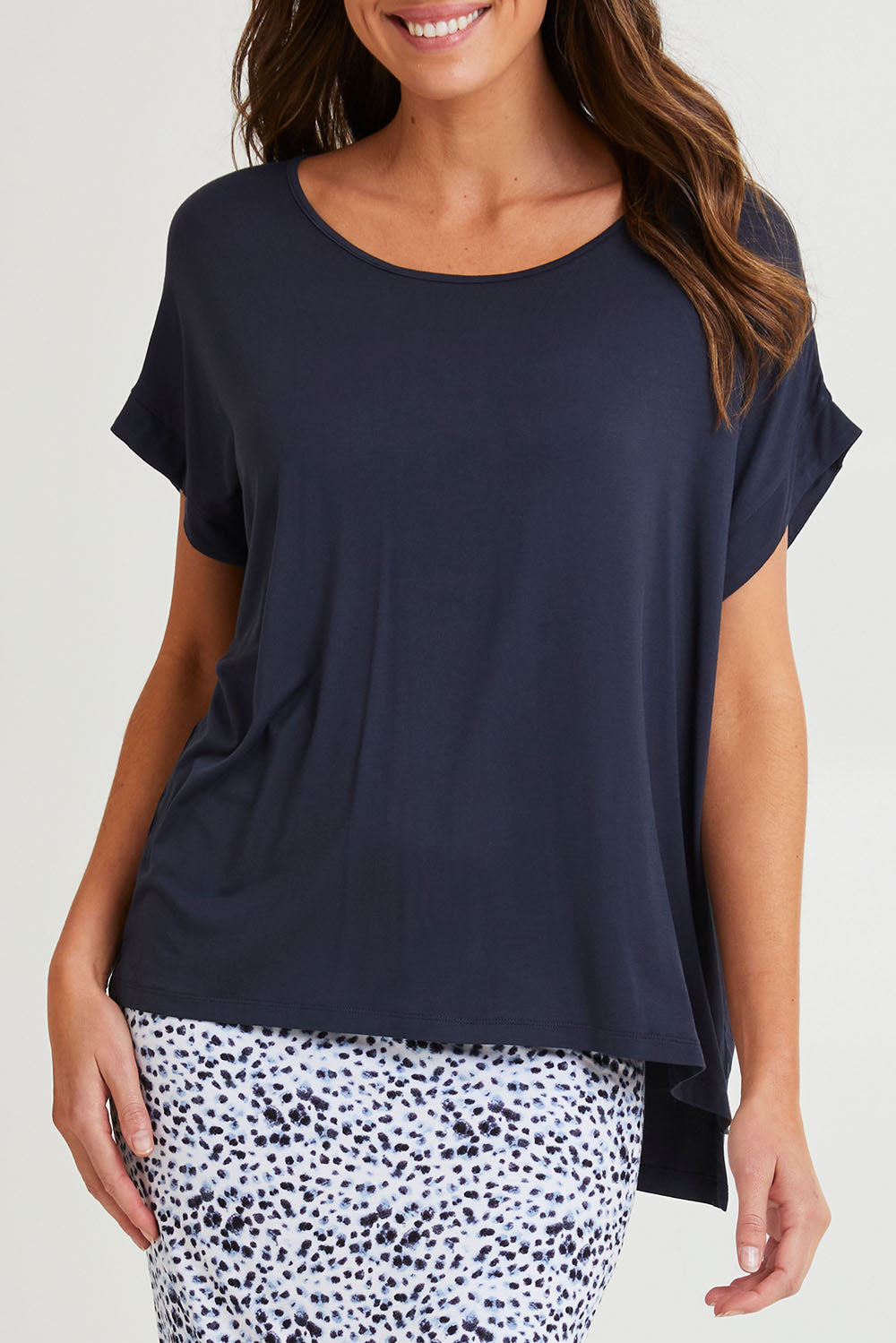 Model Madeline wearing size 10 of the Fallon Bamboo Top in colour Petrol (Blue), from the front, cropped image