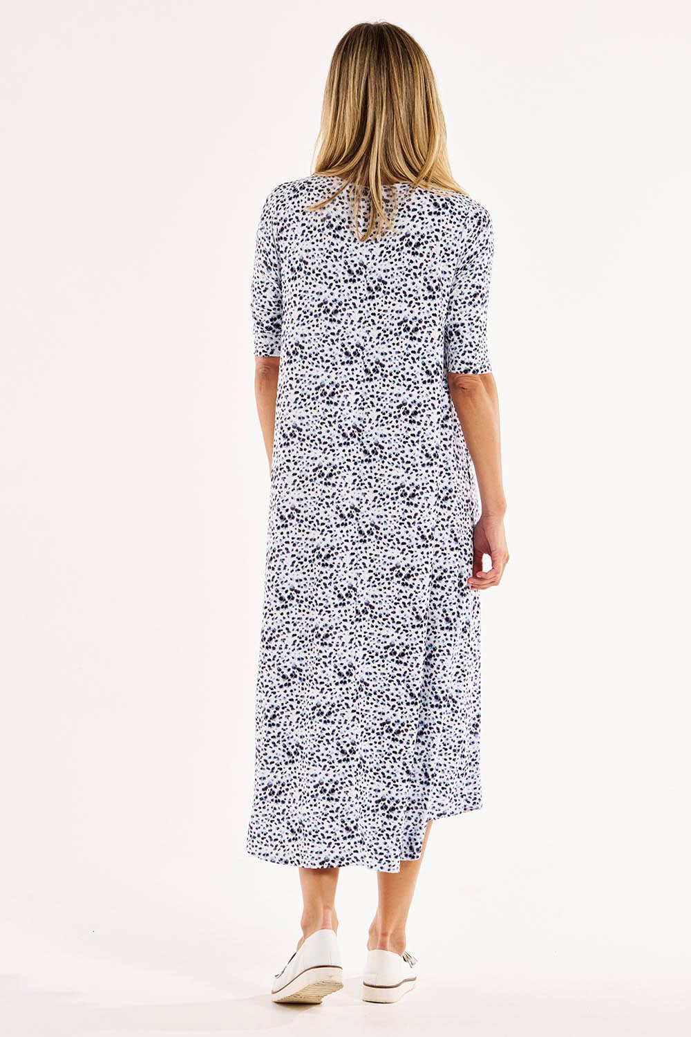 A model wearing the Marlene Bamboo Dress in colour Snowleop (White), from the back