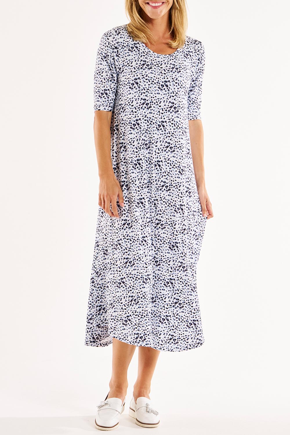 A model wearing the Marlene Bamboo Dress in colour Snowleop (White), from the front, cropped image