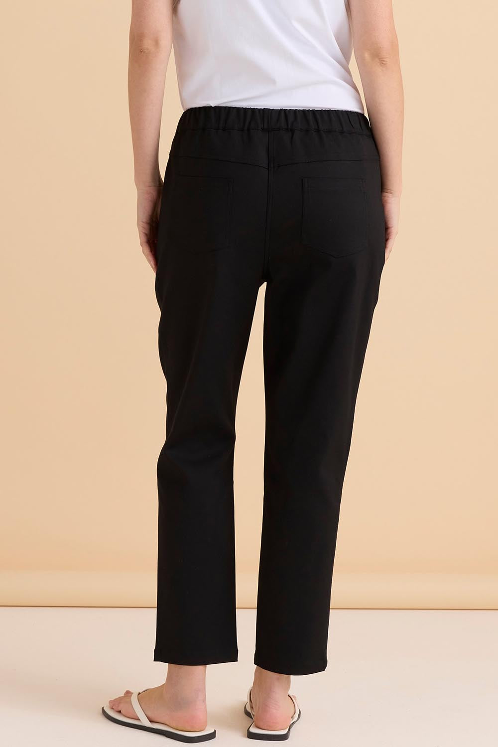 A model wearing the Kenzie Cotton Blend Jogger in colour Black (Black), from the back