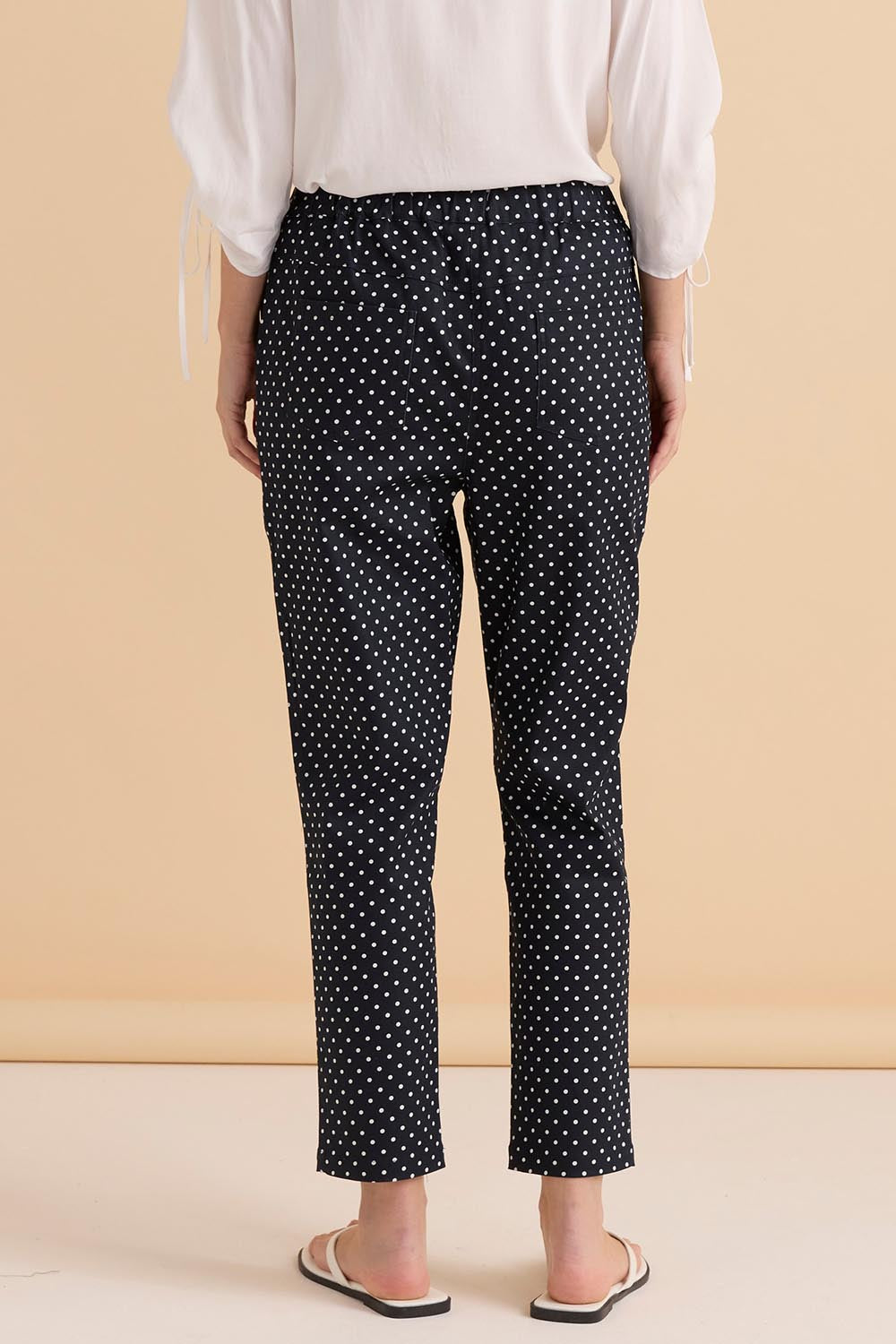 A model wearing the Kenzie Cotton Blend Jogger in colour Polkadot (Blue), from the back