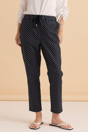 A model wearing the Kenzie Cotton Blend Jogger in colour Polkadot (Blue), from the front, cropped image