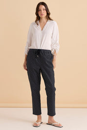 A model wearing the Kenzie Cotton Blend Jogger in colour Polkadot (Blue), from the front, showing the whole outfit