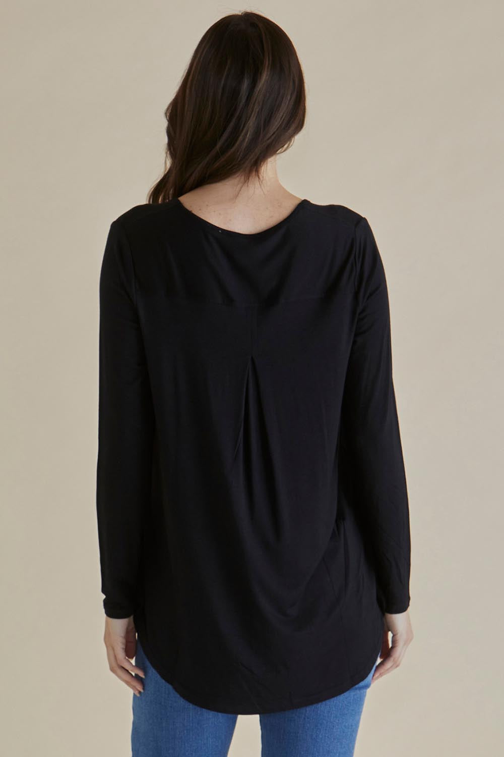 A model wearing the Yasmin Bamboo Long Sleeve Top in colour Black (Black), from the back