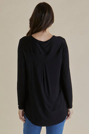 A model wearing the Yasmin Bamboo Long Sleeve Top in colour Black (Black), from the back