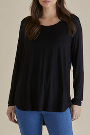 A model wearing the Yasmin Bamboo Long Sleeve Top in colour Black (Black), from the front, cropped image