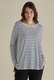 A model wearing the Yasmin Bamboo Long Sleeve Top in colour Blkstripe (White), from the front, cropped image