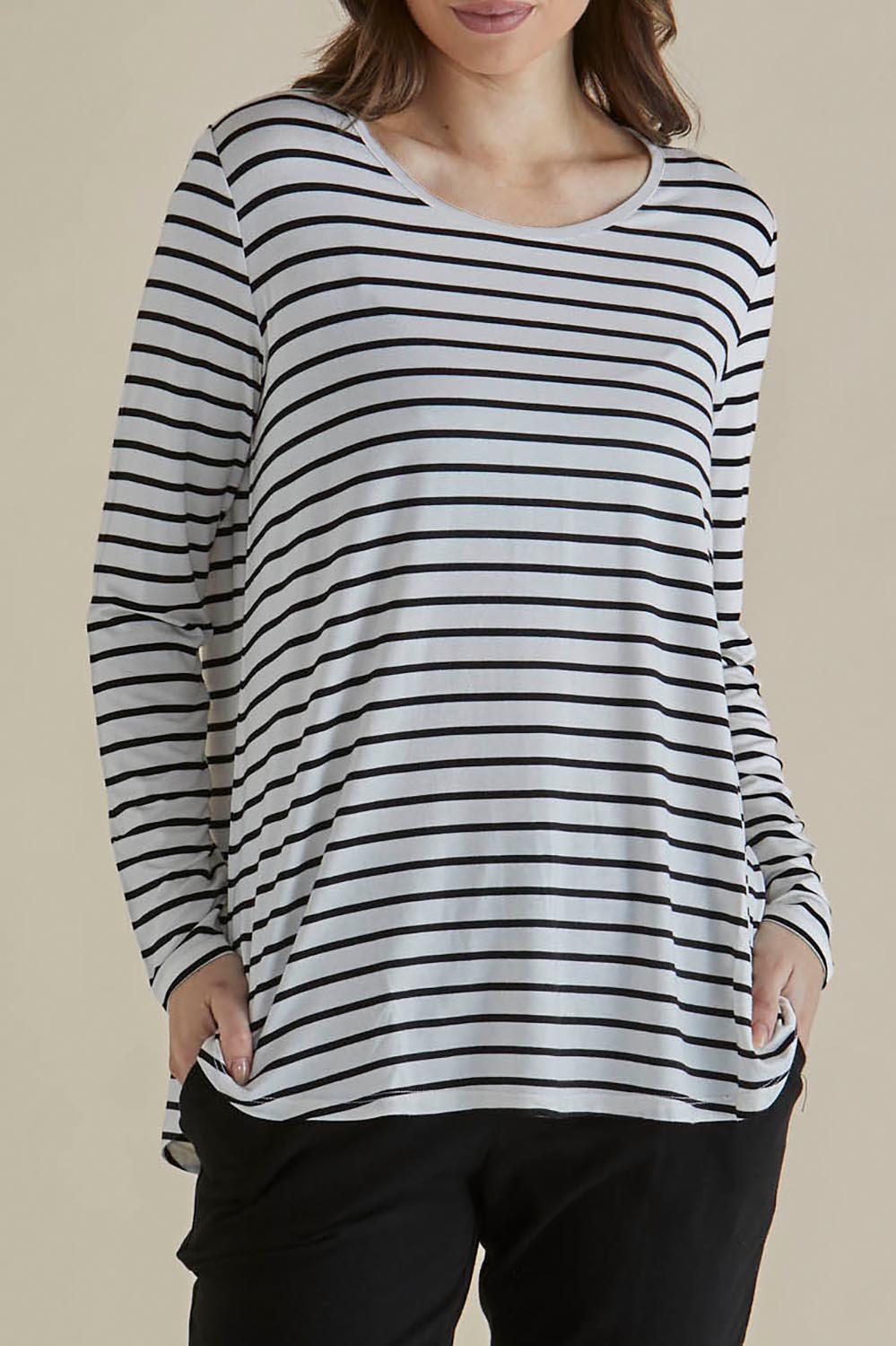 A model wearing the Yasmin Bamboo Long Sleeve Top in colour Blkstripe (White), from the front, cropped image