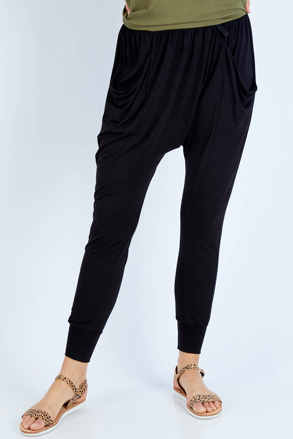 Model Gemma wearing size 10 of the Barcelona Pant in colour Black (Black), from the front, cropped image