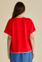 A model wearing the Avalon Cotton Tee in colour Red (Red), from the back