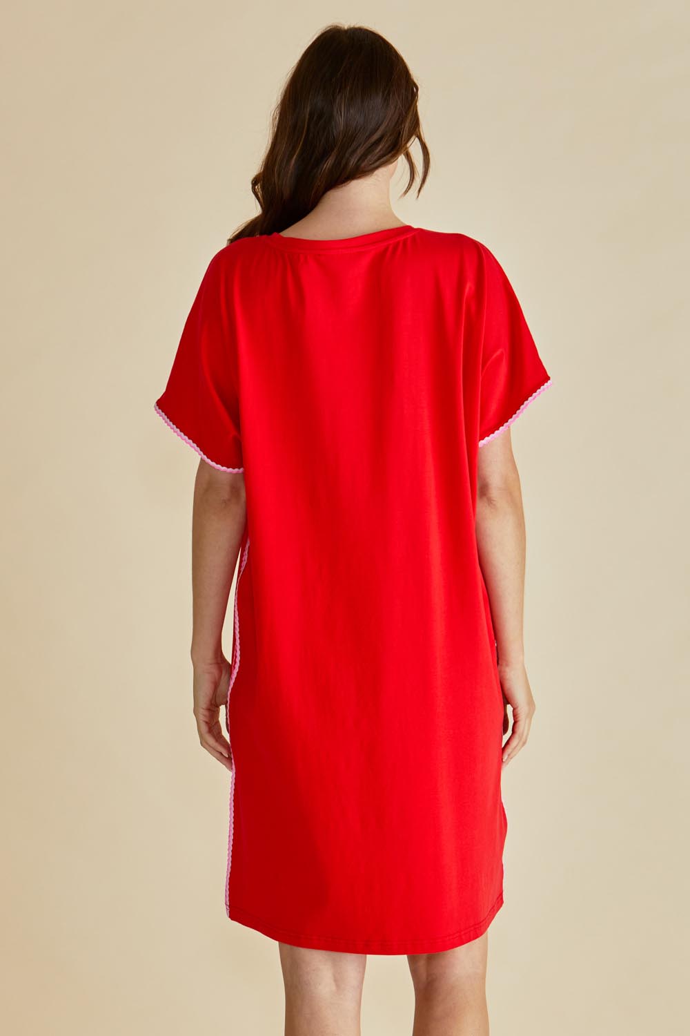 A model wearing the Stellar Cotton Tin colourShirt Dress - Red (Red), from the back