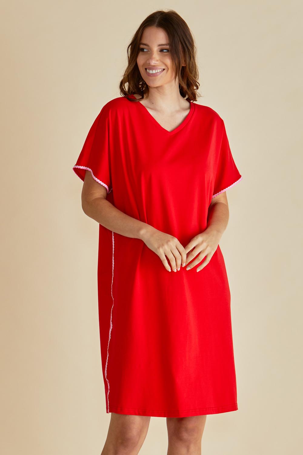A model wearing the Stellar Cotton Tin colourShirt Dress - Red (Red), from the front, cropped image