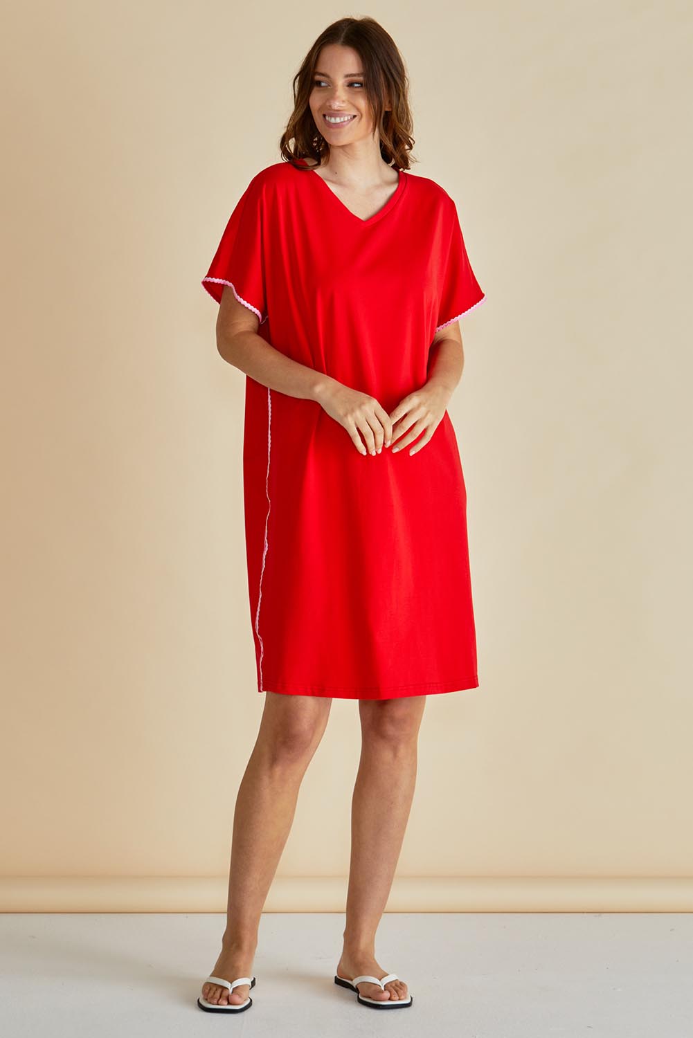 A model wearing the Stellar Cotton Tin colourShirt Dress - Red (Red), from the front, showing the whole outfit
