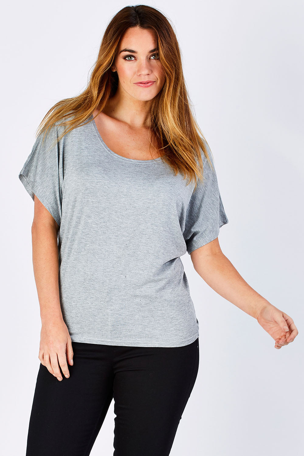 Model Laura wearing size 12 of the Maui Stretch Tee in colour SilverMarl (Grey), from the front, cropped image