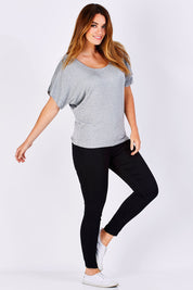 Model Laura wearing size 12 of the Maui Stretch Tee in colour SilverMarl (Grey), from the front, showing the whole outfit