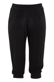 Product shot of the Tokyo Stretch 3/4 Pant in colour Black (Black), from the back