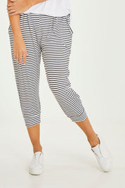 Model Georgia wearing size 10 of the Tokyo Stretch 3/4 Pant in colour Noirstripe (Black), from the front, cropped image