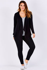 Model Laura wearing size 12 of the Melbourne Stretch Cardigan in colour Black (Black), from the front, showing the whole outfit