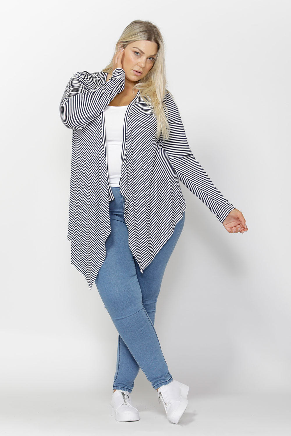 A model wearing the Melbourne Stretch Cardigan in colour NavyWhtStr (Blue), from the front, showing the whole outfit